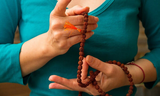 Woman holding Mala Beads