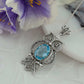 Filigree Art Owl Figured Blue Topaz Pendant